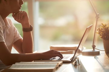 person on computer on desk