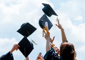 Graduation caps being thrown in the air - can a postgraduate certificate change your career path?